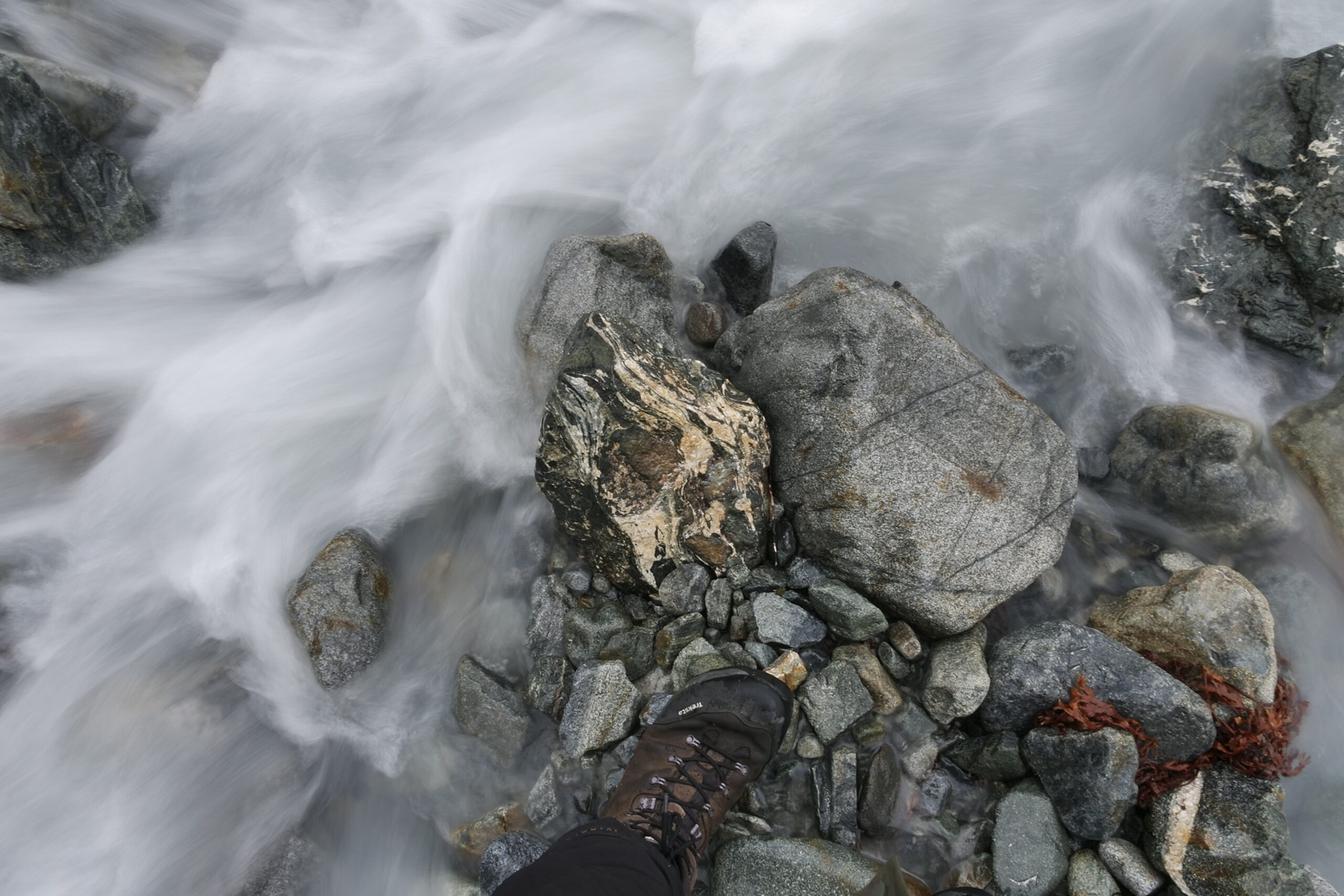 river flowing around a stone
